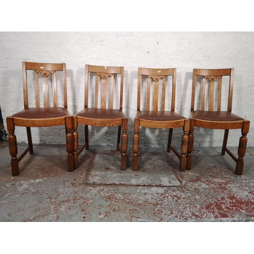 1044 - A set of four 1930s oak dining chairs with brown leatherette upholstery