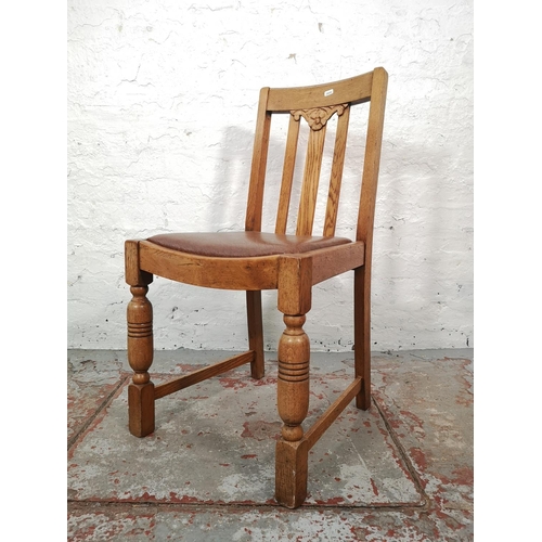 1044 - A set of four 1930s oak dining chairs with brown leatherette upholstery