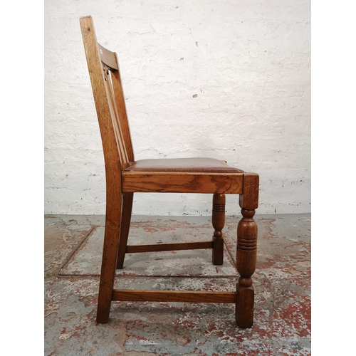 1044 - A set of four 1930s oak dining chairs with brown leatherette upholstery