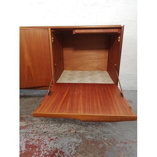 1047 - An A.H. McIntosh teak sideboard with three drawers and three cupboard doors - approx. 75cm high x 20... 
