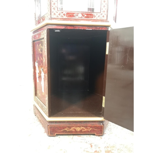 1051 - An Oriental red lacquered hexagonal display cabinet with mother of pearl Geisha girl design and two ... 