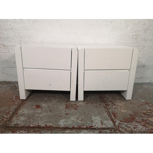 1052 - A pair of modern white painted bedside chests of two drawers - approx. 49cm high x 51cm wide x 41cm ... 