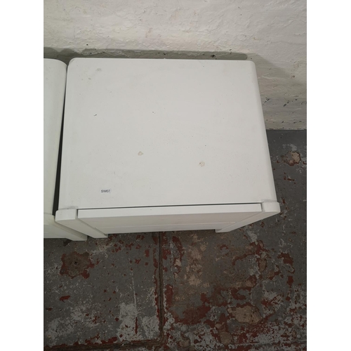 1052 - A pair of modern white painted bedside chests of two drawers - approx. 49cm high x 51cm wide x 41cm ... 