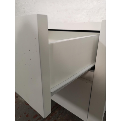 1052 - A pair of modern white painted bedside chests of two drawers - approx. 49cm high x 51cm wide x 41cm ... 