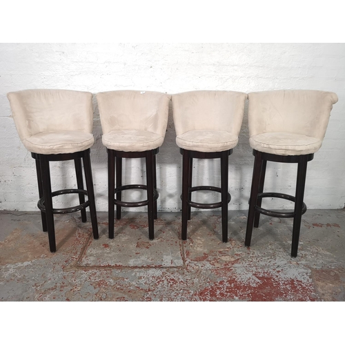 1055 - A set of four modern white suede and hardwood kitchen bar stools - approx. 111cm high x 59cm wide x ... 