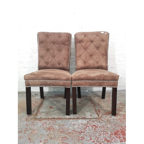 1056 - A pair of modern brown suede button back dining chairs with metal studding - approx. 100cm high x 49... 