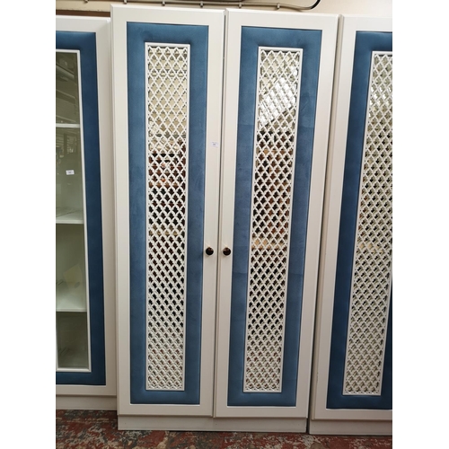 1061 - A contemporary white painted and blue fabric double mirrored door wardrobe - approx. 208cm high x 10... 