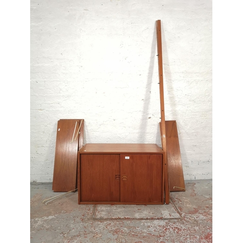 1064 - A mid 20th century Danish teak modular wall system cabinet with shelving - cabinet approx. 50cm high... 