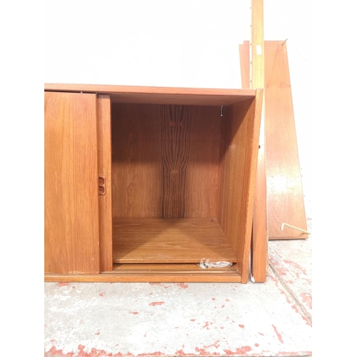 1064 - A mid 20th century Danish teak modular wall system cabinet with shelving - cabinet approx. 50cm high... 