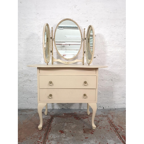 1066 - A French style cream painted kidney shaped dressing table with upper oval three section mirror and t... 