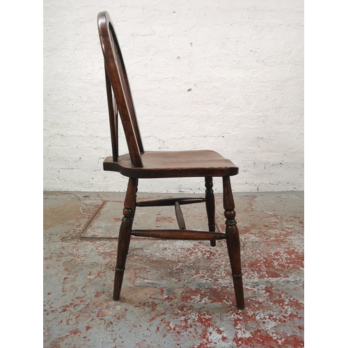 1067 - A set of four Victorian style elm and beech wheel back dining chairs - approx. 92cm high x 35cm wide... 