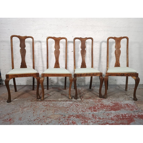 1069 - A set of four Queen Anne style oak dining chairs