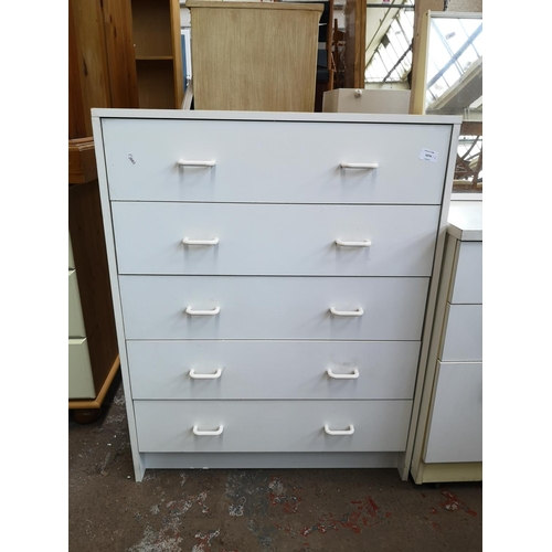 1074 - Two white laminate chests of drawers - largest approx. 92cm high x 72cm wide x 39cm deep