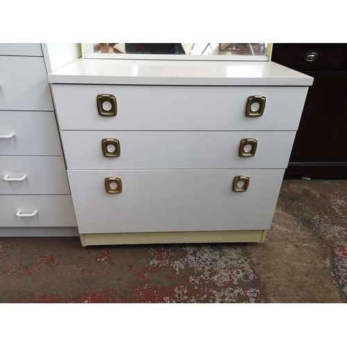 1074 - Two white laminate chests of drawers - largest approx. 92cm high x 72cm wide x 39cm deep