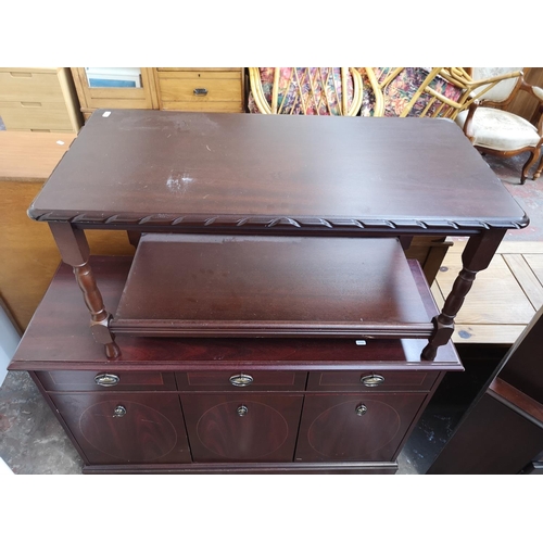 1075 - Three pieces of mahogany effect furniture, one drop leaf swivel top side table with lyre end support... 