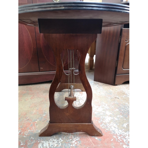 1075 - Three pieces of mahogany effect furniture, one drop leaf swivel top side table with lyre end support... 