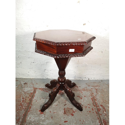 1079 - A Victorian style mahogany octagonal pedestal sewing table with fitted interior - approx. 74cm high ... 