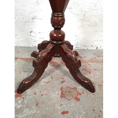 1079 - A Victorian style mahogany octagonal pedestal sewing table with fitted interior - approx. 74cm high ... 