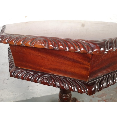 1079 - A Victorian style mahogany octagonal pedestal sewing table with fitted interior - approx. 74cm high ... 