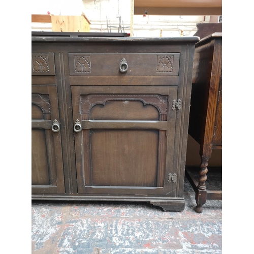 1080 - A late 20th century oak sideboard with two drawers and two cupboard doors - approx. 90cm high x 125c... 