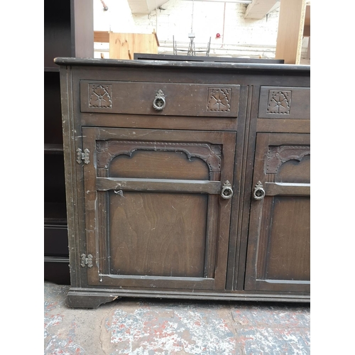 1080 - A late 20th century oak sideboard with two drawers and two cupboard doors - approx. 90cm high x 125c... 