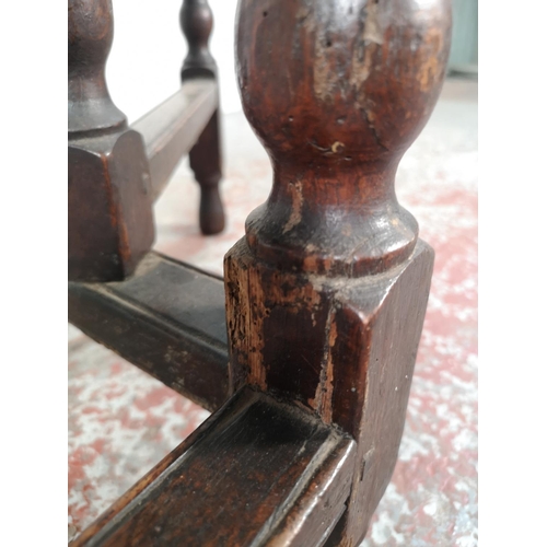 1081 - An 18th century oak drop leaf gate leg oval dining table with barley twist supports - approx. 72cm h... 