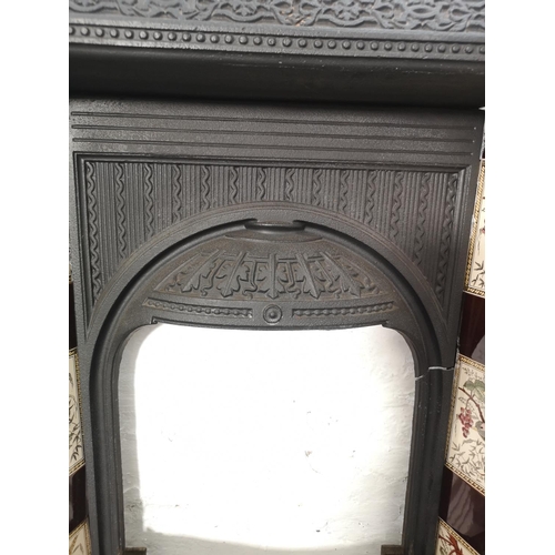 1083 - A Victorian Biclam cast iron fire surround with ceramic tiles - approx. 92cm high x 76.5cm wide x 17... 