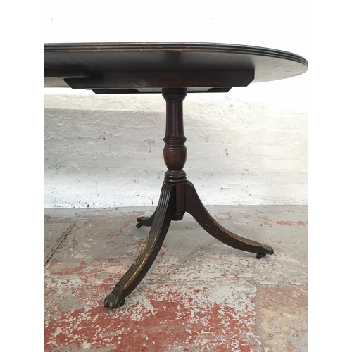 1086 - A Regency style mahogany oval extending dining table with six matching chairs - approx. 74.5cm high ... 