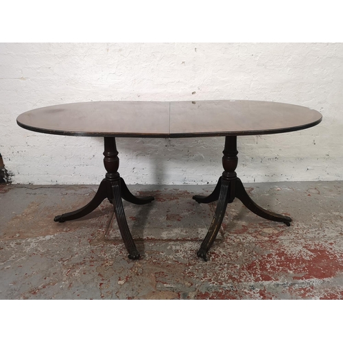 1086 - A Regency style mahogany oval extending dining table with six matching chairs - approx. 74.5cm high ... 