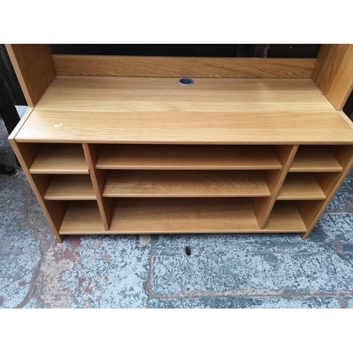 1087 - A modern oak effect media unit - approx. 214cm high x 120cm wide x 51cm deep