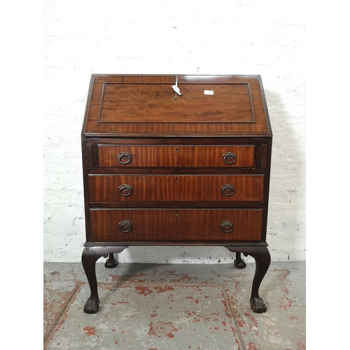 1088 - A Georgian style mahogany bureau with three drawers, fall front and ball and claw supports - approx.... 