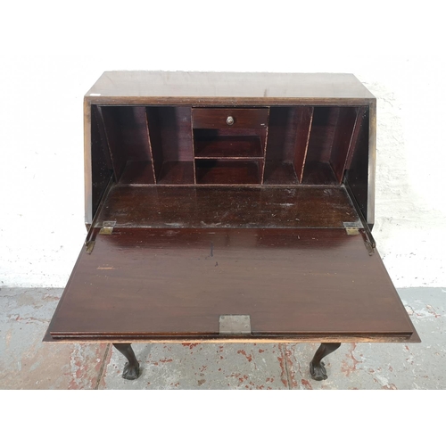 1088 - A Georgian style mahogany bureau with three drawers, fall front and ball and claw supports - approx.... 