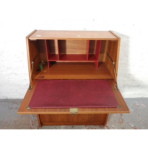 1092 - A Remploy teak bureau with two lower cupboard doors, single drawer and fall front - approx. 102cm hi... 