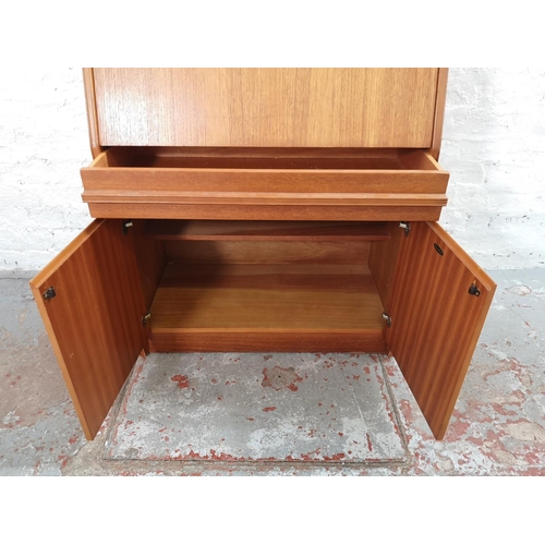 1092 - A Remploy teak bureau with two lower cupboard doors, single drawer and fall front - approx. 102cm hi... 