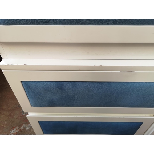 1093 - Three pieces of contemporary white painted and blue fabric furniture, two bedside cabinets - approx.... 