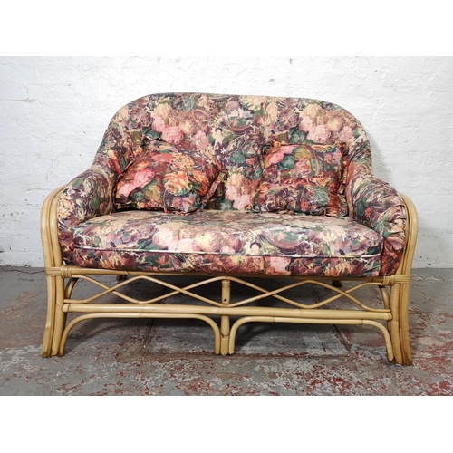 1100 - A mid/late 20th century bamboo three piece conservatory suite comprising two armchairs and sofa