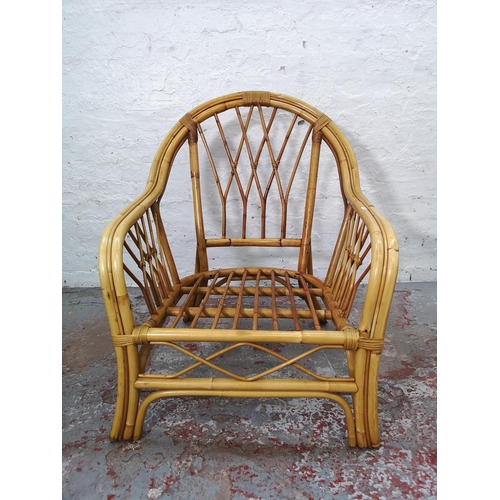 1100 - A mid/late 20th century bamboo three piece conservatory suite comprising two armchairs and sofa