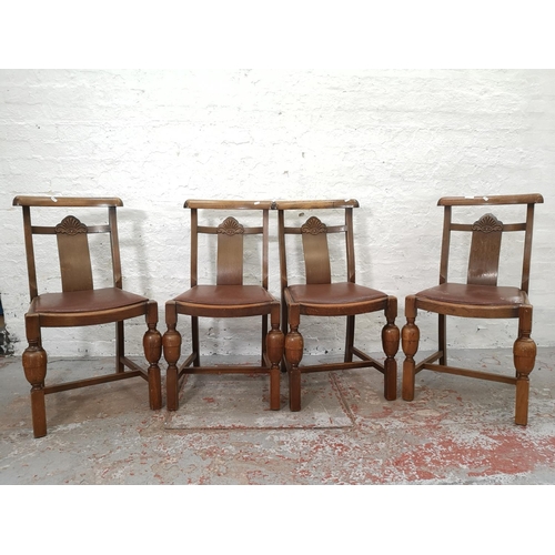 1103 - A set of four Art Deco style oak dining chairs with baluster supports and brown leatherette upholste... 