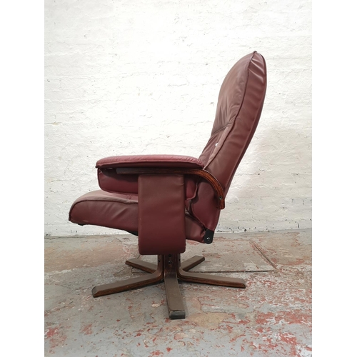 1104 - A Unico red leather swivel armchair - approx. 102cm high x 78cm wide x 70cm deep