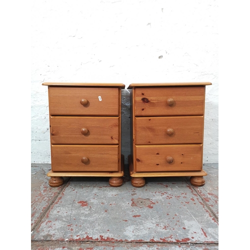 1111 - A pair of modern pine bedside chests of three drawers - approx. 59cm high x 44cm wide x 38cm deep