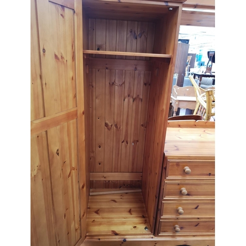 1114 - A large modern pine double wardrobe with four central drawers - approx. 193cm high x 217cm wide x 66... 