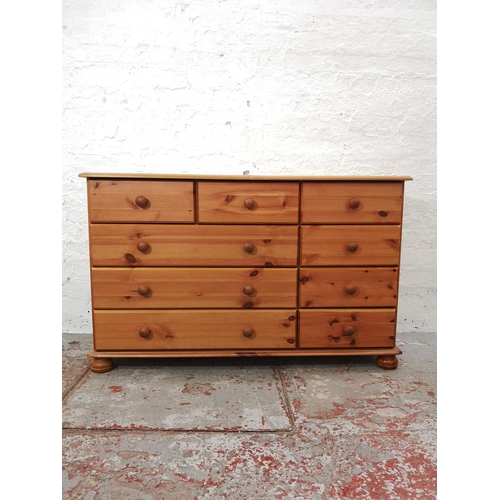 1115 - A modern pine chest of six short and three long drawers - approx. 74.5cm high x 121cm wide x 38cm de... 