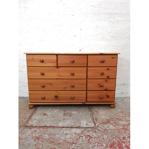 1116 - A modern pine chest of six short and three long drawers - approx. 74.5cm high x 121cm wide x 38cm de... 