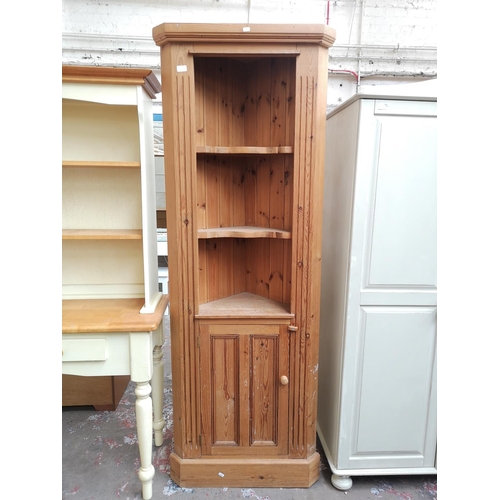 1118B - A modern solid pine freestanding corner cabinet with three upper shelves and lower cupboard door - a... 