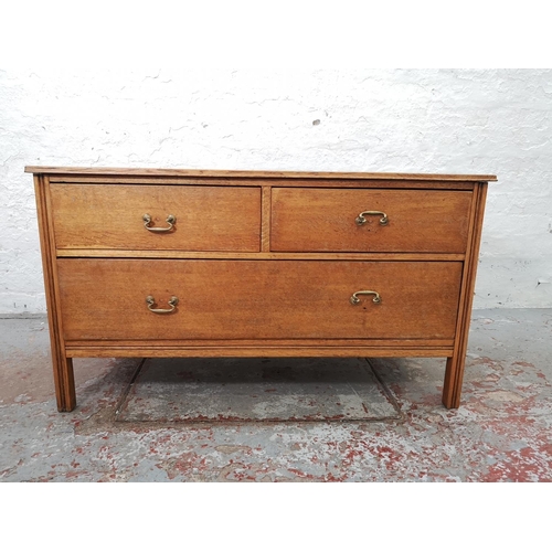 1123 - A mid 20th century oak chest of two short over one long drawers - approx. 61cm high x 106cm wide x 4... 