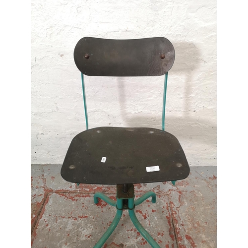 1128 - A 1950's green painted metal industrial adjustable factory chair - approx. 87cm high x 38cm wide x 2... 