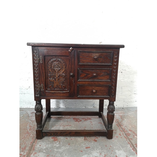 1132 - A Jaycee oak side cabinet with three drawers and one cupboard door - approx. 73cm high x 65cm wide x... 