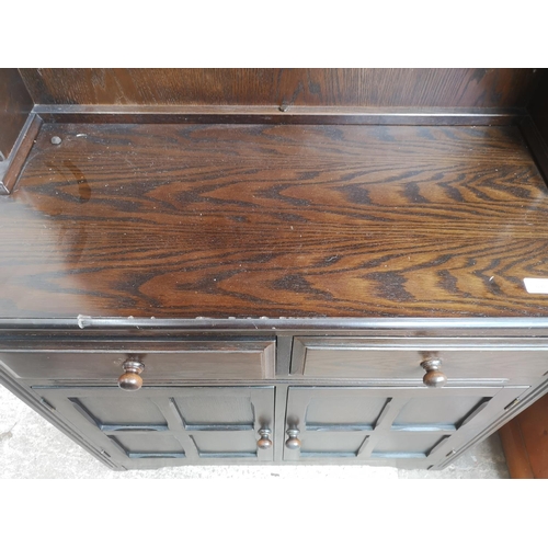 1139 - An oak Dutch dresser with upper two tier plate rack, two drawers and two lower cupboard doors - appr... 