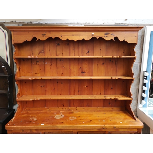 1140 - A 19th century style solid pine Welsh dresser with upper three tier plate rack, four drawers and fou... 