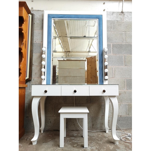 1141 - A contemporary white painted and blue fabric dressing table with three drawers, glass top, bevel edg... 